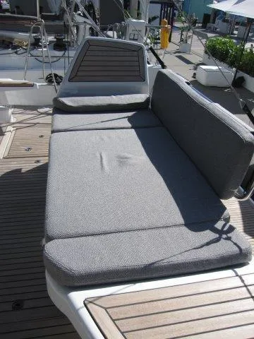 Slide: The Image of 2025 Jeanneau Yacht 65 deck with cushioned seating area. - 36