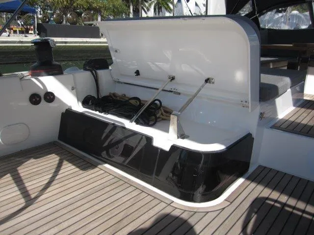 Slide: The Image of Jeanneau Yacht 65 (2025) open storage compartment on deck with ropes and equipment. - 39