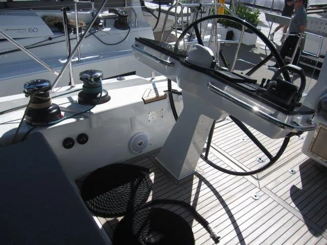 Slide: The Image of Cockpit of 2025 Jeanneau Yacht 65 with steering wheel and winches. - 41