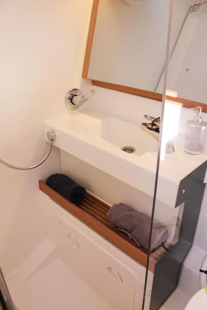 Slide: The Image of Modern bathroom in 2024 Jeanneau Sun Odyssey 490 yacht with sink and mirror. - 18