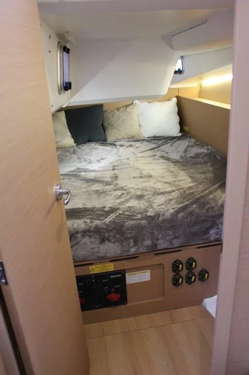 Slide: The Image of Cozy cabin interior of 2024 Jeanneau Sun Odyssey 490 sailboat with plush bedding. - 33