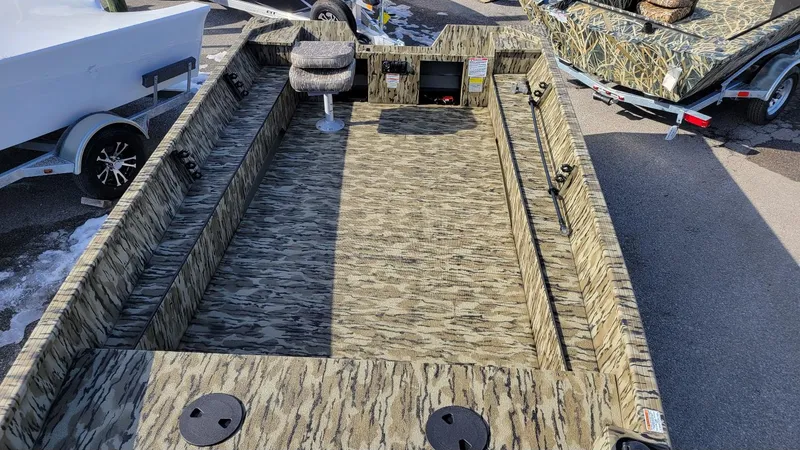 Slide: The Image of 2025 Smoker Craft Sportsman 1866 camo boat with Yamaha 70 hp engine, interior view. - 14