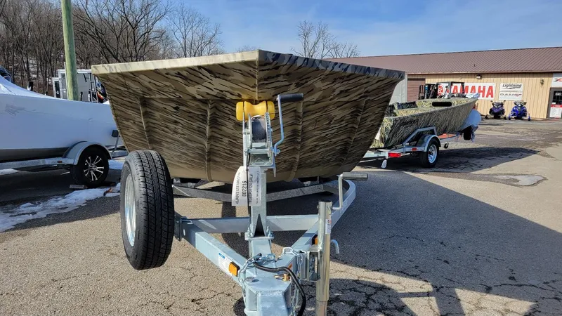 Slide: The Image of 2025 Smoker Craft Sportsman 1866 camo boat with Yamaha 70 hp engine on trailer. - 6