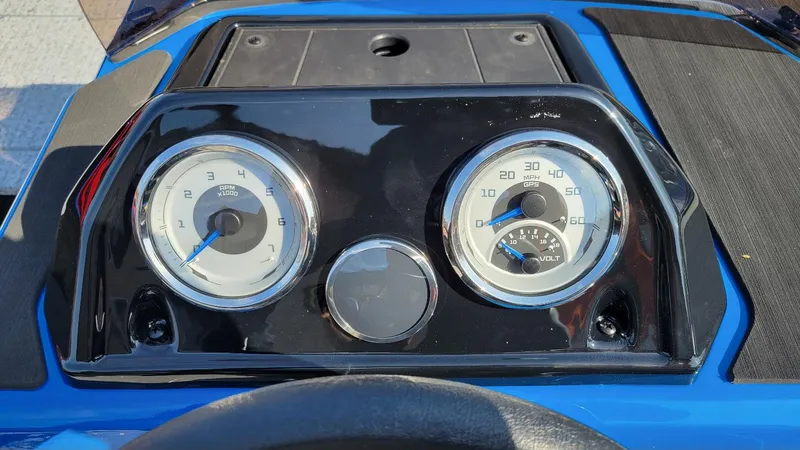 Slide: The Image of 2025 Smoker Craft Lazer 161 side console dashboard with RPM and speed gauges. - 14
