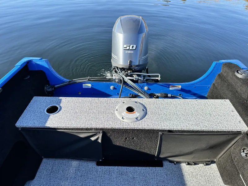 Slide: The Image of 2025 Smoker Craft Lazer 161 side console boat with Yamaha 50 engine on water. - 17