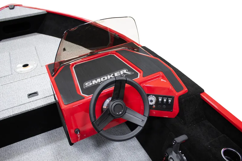Slide: The Image of 2025 Smoker Craft Lazer 161 side console, red interior, steering wheel, and dashboard controls. - 14