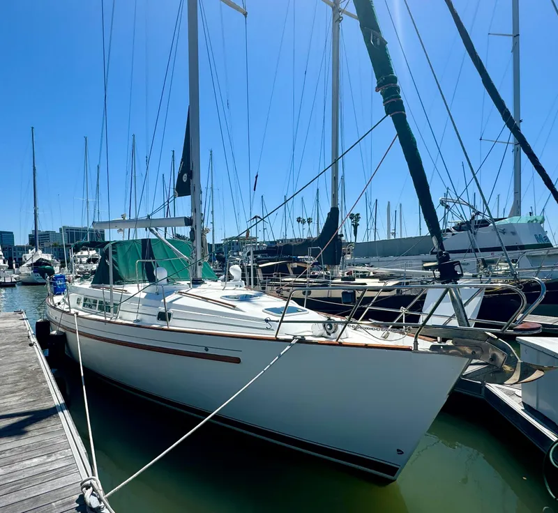 Slide: The Image of 1996 Beneteau Oceanis 40 CC sailboat docked in marina under clear blue sky. - 2