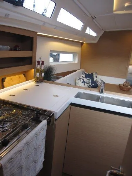 Slide: The Image of Modern kitchen area in 2024 Jeanneau 380 sailboat with sleek design. - 10