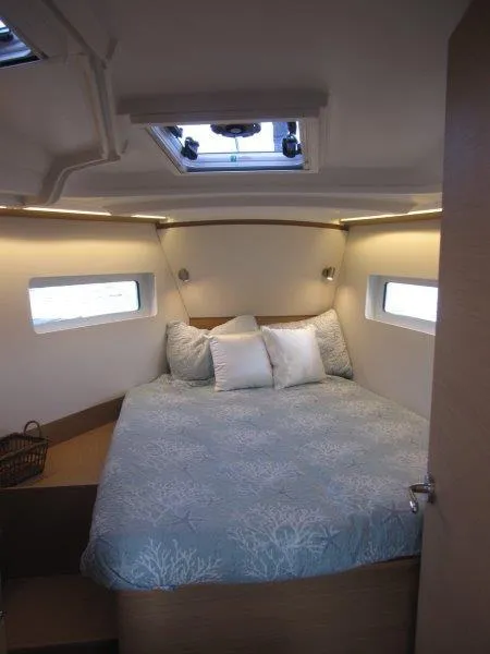 Slide: The Image of Luxurious cabin interior of 2024 Jeanneau 380 sailboat with cozy bed and natural light. - 22