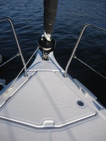 Slide: The Image of Bow of 2024 Jeanneau 380 sailboat on calm water. - 45