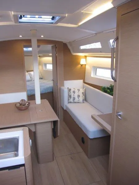 Slide: The Image of Modern interior of 2024 Jeanneau 380 sailboat with cozy seating and natural light. - 5