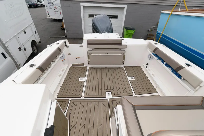 Slide: The Image of 2021 Cutwater C-24 DC boat interior with spacious seating and teak flooring. - 11