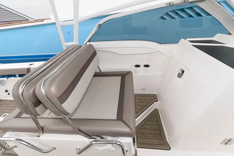 Slide: The Image of 2021 Cutwater C-24 DC boat interior with cushioned seating and sleek design. - 18