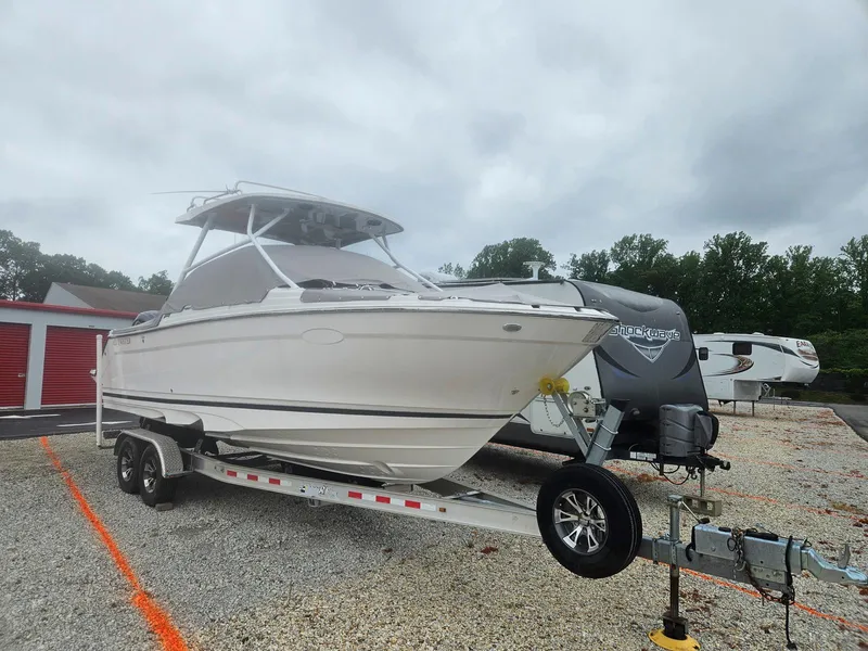Slide: The Image of 2021 Cutwater C-24 DC boat on a trailer in a storage lot. - 3