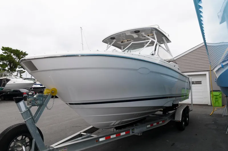 Slide: The Image of 2021 Cutwater C-24 DC boat on trailer, parked outdoors. - 5