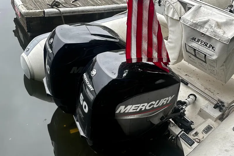 The Image of 2003 Novurania 530 DL with twin Mercury outboard engines docked. - 1