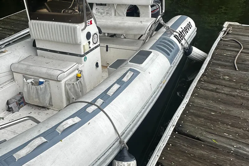 Slide: The Image of 2003 Novurania 530 DL inflatable boat docked at a wooden pier. - 4