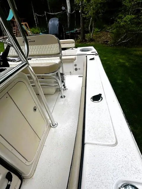 Slide: The Image of 2022 Sea Chaser 22 HFC boat interior with seating and storage compartments. - 15