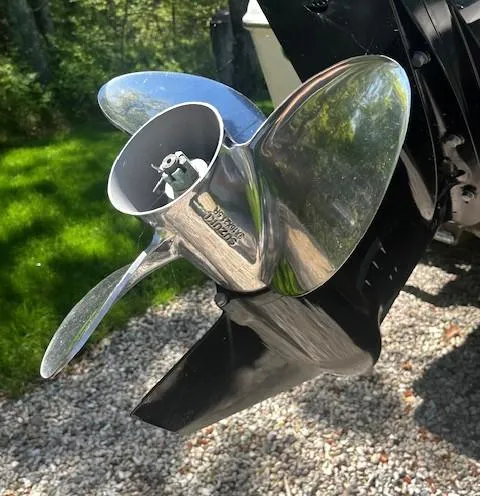 Slide: The Image of Propeller of 2022 Sea Chaser 22 HFC boat, shiny metal finish, on gravel background. - 19