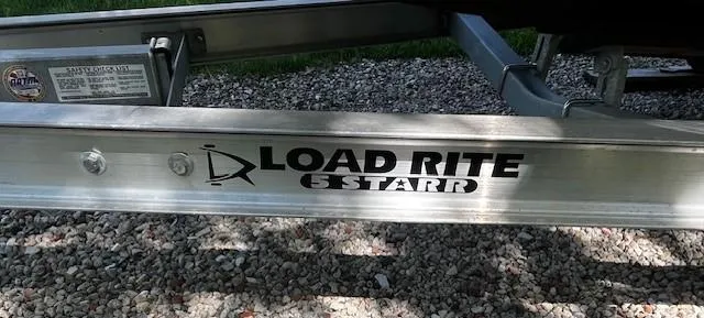 Slide: The Image of Load Rite 5 Starr trailer for 2022 Sea Chaser 22 HFC boat on gravel. - 20