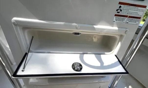Slide: The Image of Open storage compartment on 2022 Sea Chaser 22 HFC boat. - 23