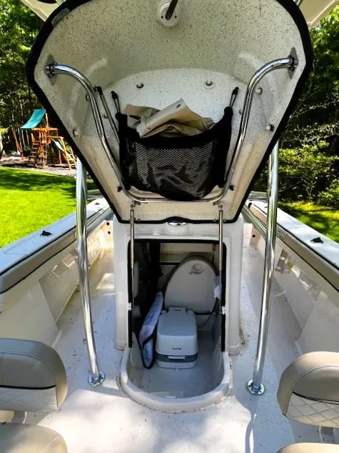 Slide: The Image of 2022 Sea Chaser 22 HFC boat interior with storage and seating. - 25