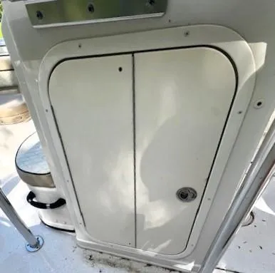 Slide: The Image of 2022 Sea Chaser 22 HFC boat interior with storage compartment and seating. - 27