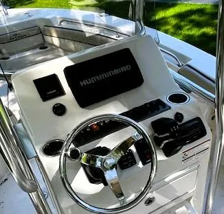 Slide: The Image of 2022 Sea Chaser 22 HFC boat console with steering wheel and Humminbird electronics. - 36