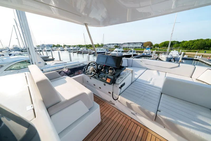 Slide: The Image of 2024 Sirena 48 yacht cockpit with modern navigation system and luxurious seating. - 11