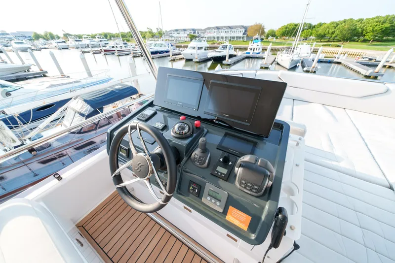 Slide: The Image of Control panel of the 2024 Sirena 48 yacht docked at a marina. - 17