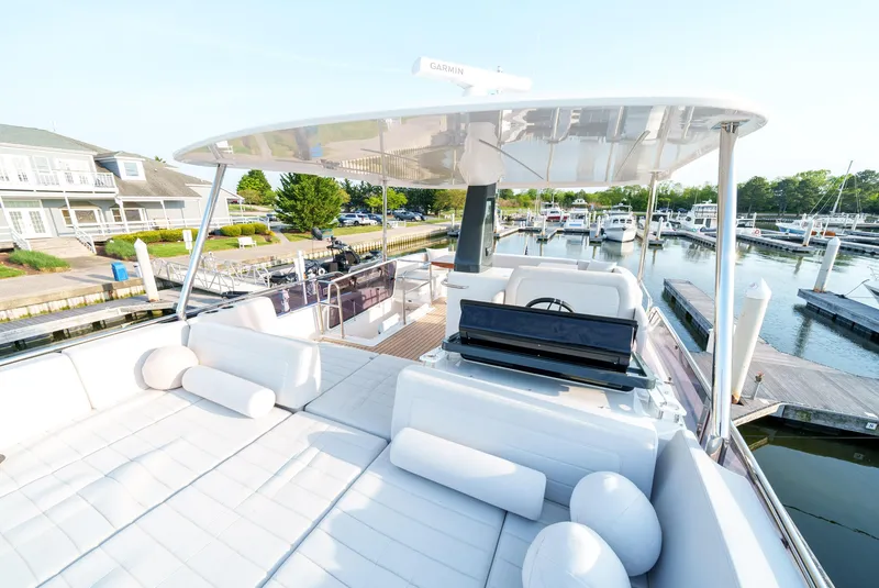 Slide: The Image of 2024 Sirena 48 yacht with spacious deck and marina view. - 18