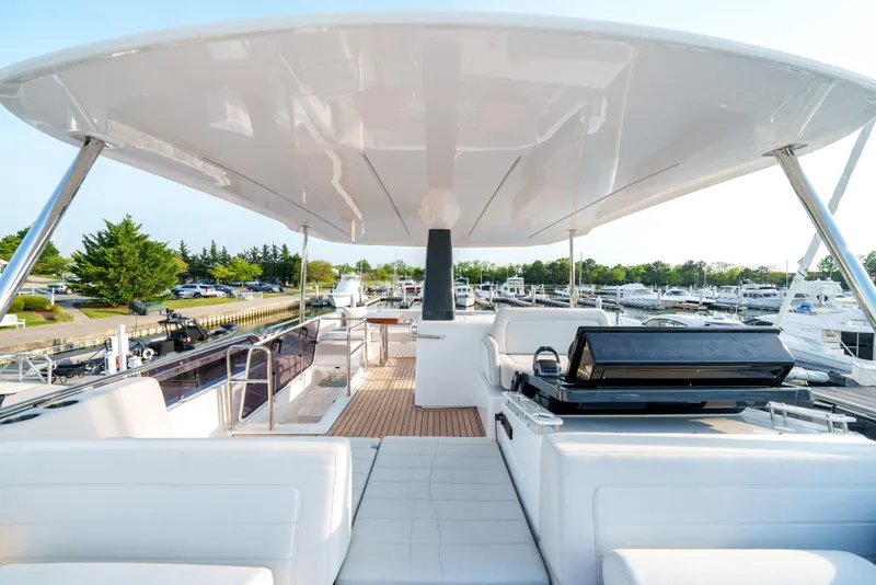 Slide: The Image of 2024 Sirena 48 yacht with spacious deck and modern amenities at marina. - 20