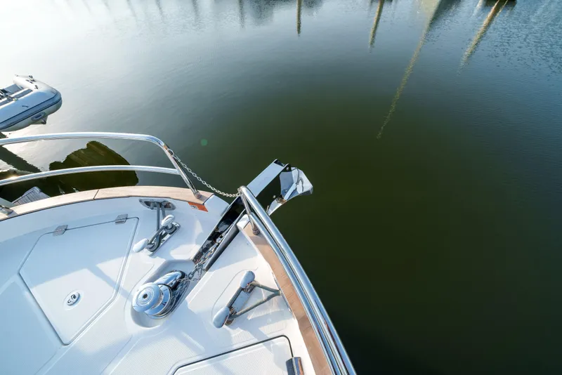 Slide: The Image of Bow of 2024 Sirena 48 yacht with anchor and calm water. - 24