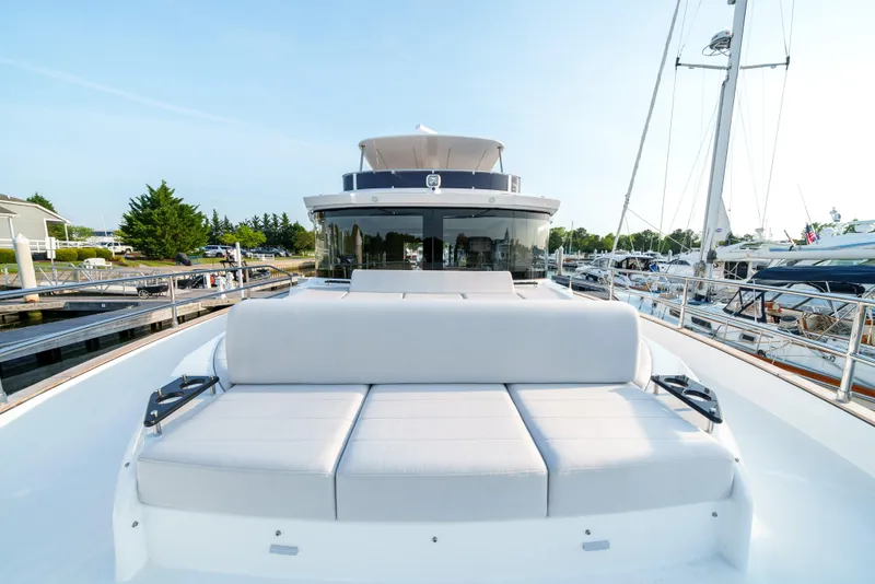 Slide: The Image of 2024 Sirena 48 yacht with spacious deck and luxurious seating. - 26