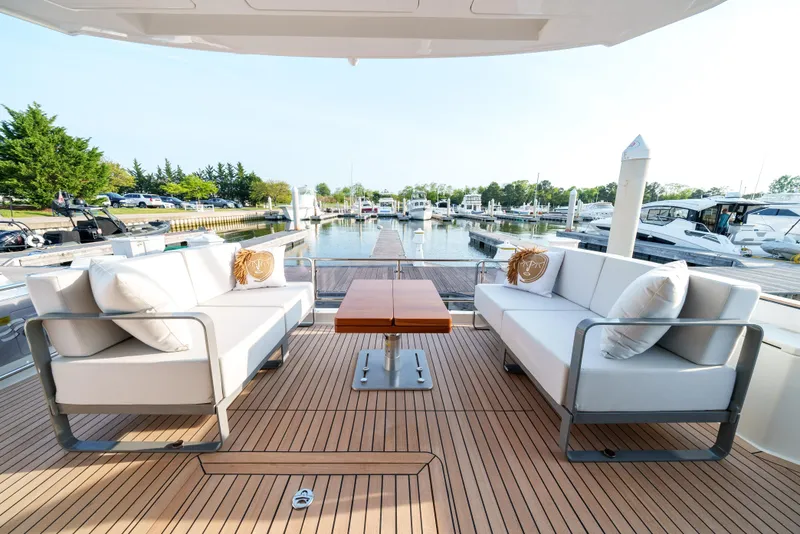 Slide: The Image of Luxury deck seating on 2024 Sirena 48 yacht at marina. - 28