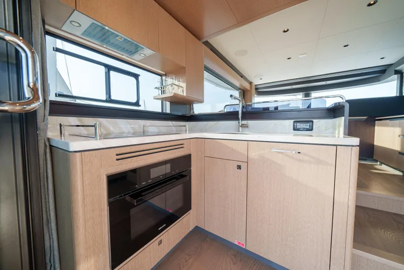 Slide: The Image of Modern kitchen interior of 2024 Sirena 48 yacht with sleek cabinetry and appliances. - 30