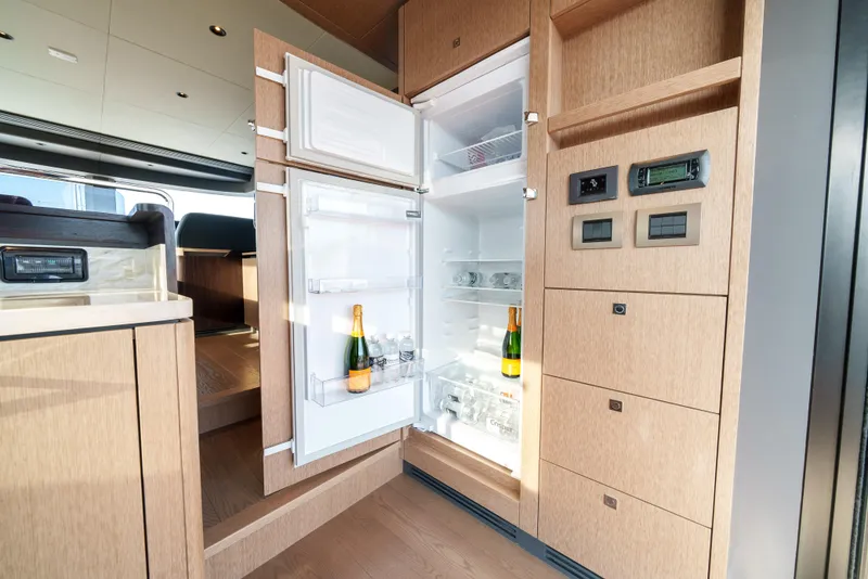 Slide: The Image of Modern kitchen with open fridge in 2024 Sirena 48 yacht. - 31