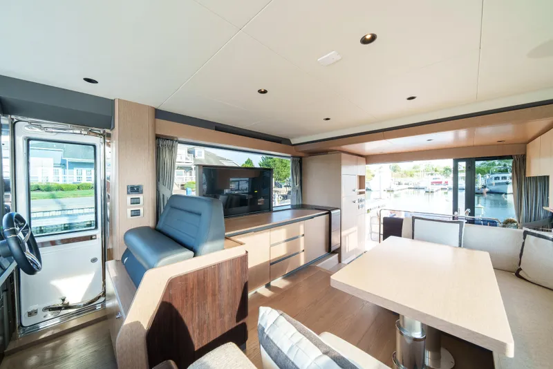 Slide: The Image of Modern interior of 2024 Sirena 48 yacht with spacious seating and large windows. - 33