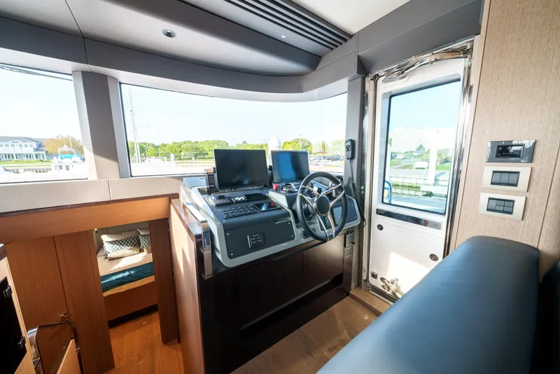 Slide: The Image of 2024 Sirena 48 yacht helm station with modern navigation equipment. - 34