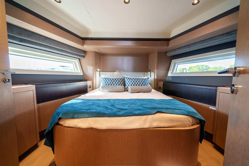 Slide: The Image of Luxurious bedroom interior of 2024 Sirena 48 yacht with modern design and large windows. - 35