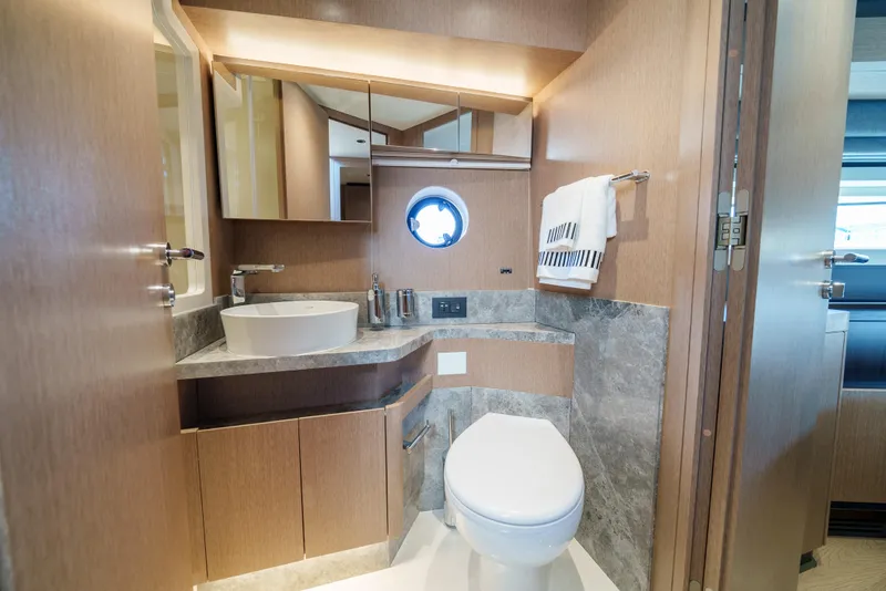 Slide: The Image of Modern bathroom in 2024 Sirena 48 yacht with sleek fixtures and wood accents. - 36