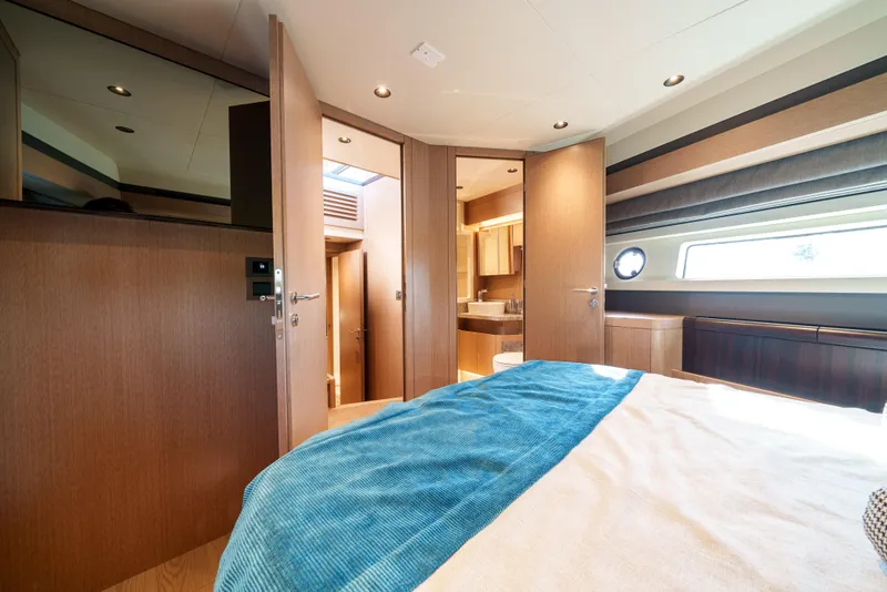 Slide: The Image of Luxurious bedroom interior of 2024 Sirena 48 yacht with modern wood finishes. - 37