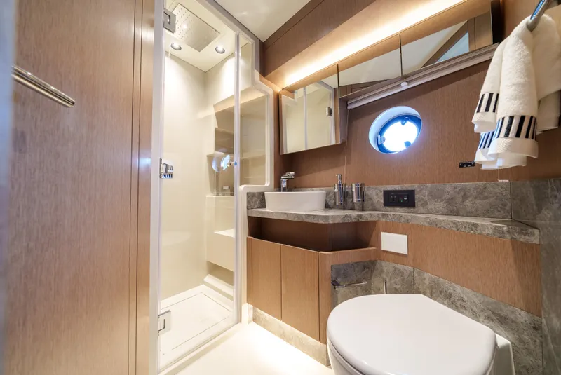 Slide: The Image of Modern bathroom in 2024 Sirena 48 yacht with shower, sink, and toilet. - 38