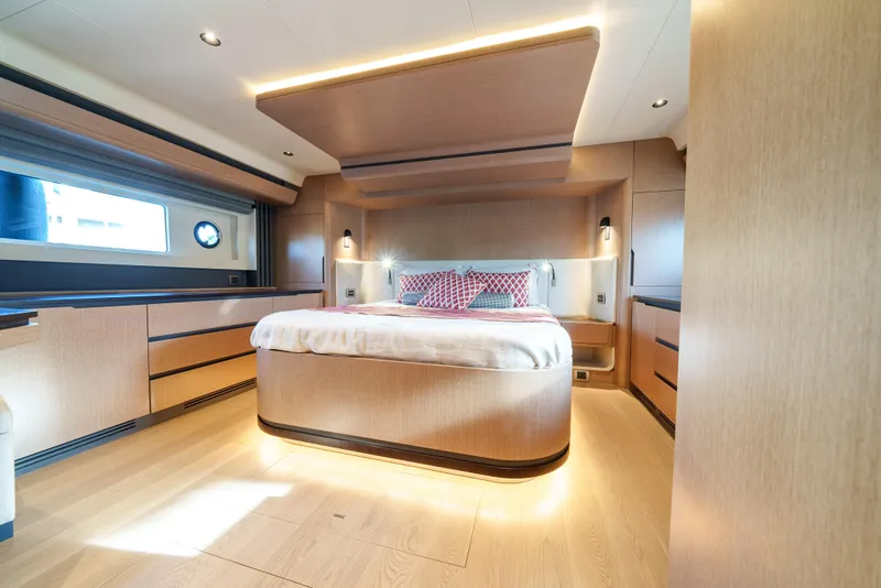 Slide: The Image of Luxurious master bedroom on the 2024 Sirena 48 yacht with modern wood finishes. - 40