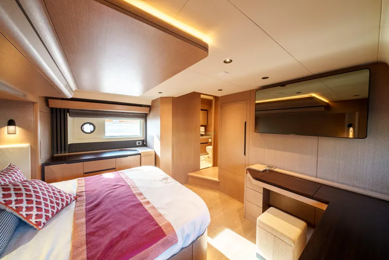 Slide: The Image of Luxurious bedroom interior of 2024 Sirena 48 yacht with modern furnishings and ambient lighting. - 42