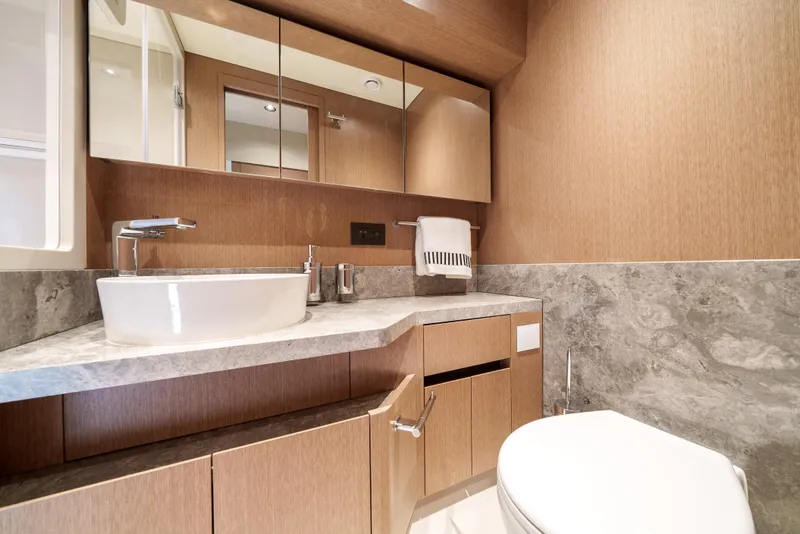 Slide: The Image of Modern bathroom in 2024 Sirena 48 yacht with sleek fixtures and wooden cabinetry. - 44