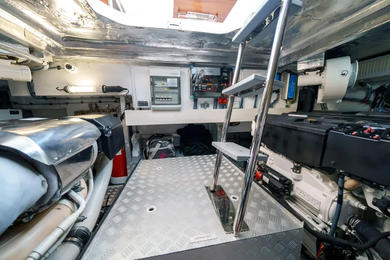 Slide: The Image of Engine room of a 2024 Sirena 48 yacht with modern equipment and metallic flooring. - 47