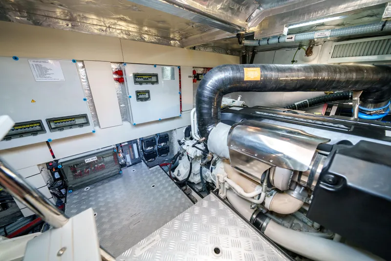 Slide: The Image of Engine room of 2024 Sirena 48 yacht with advanced machinery and control panels. - 48