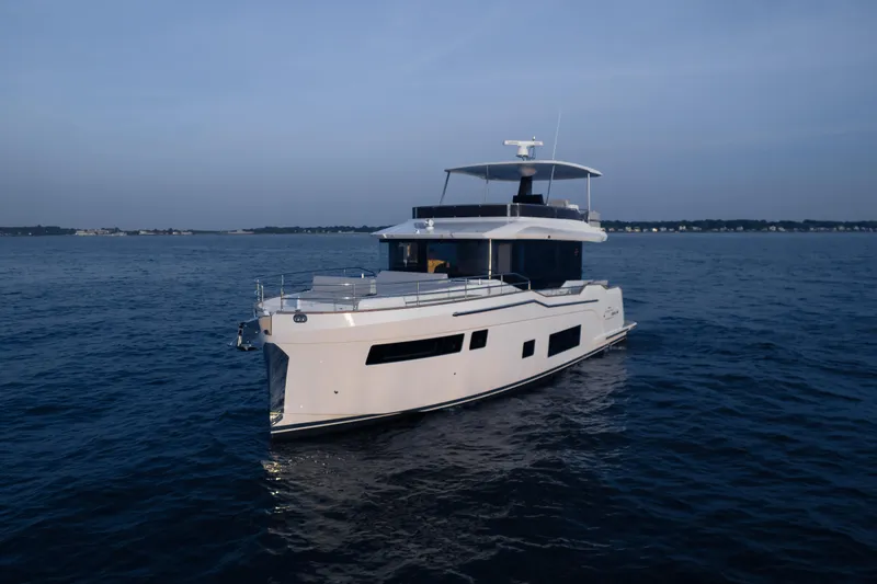 Slide: The Image of 2024 Sirena 48 yacht cruising on open water. - 49