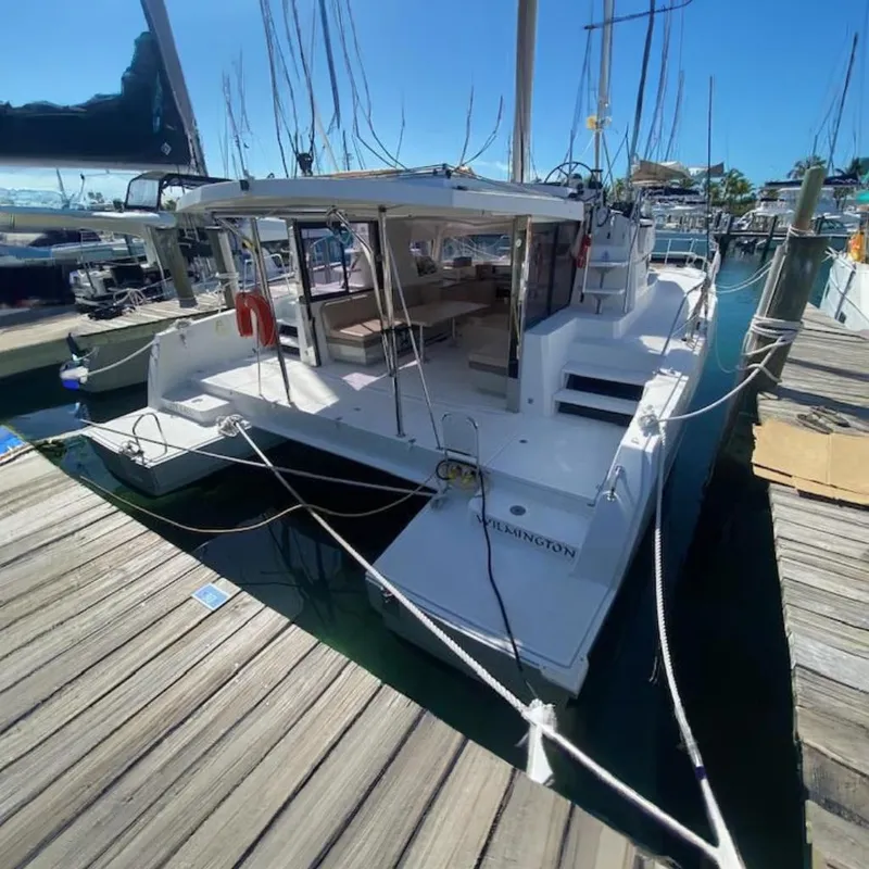 The Image of 2017 Bali 4.0 catamaran with spacious deck and seating area docked at marina. - 0
